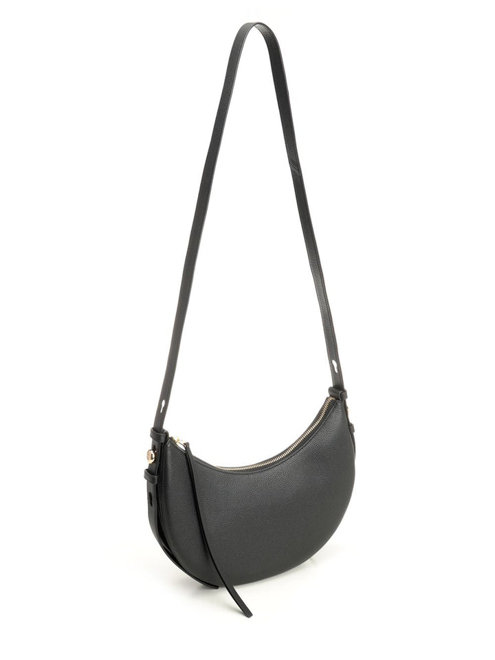 Tory Burch Romy Half Moon Bag Shoulder Bags - Black | 4244caec3c40c0cf50c3e0c7d8b8bbb58be72cb3