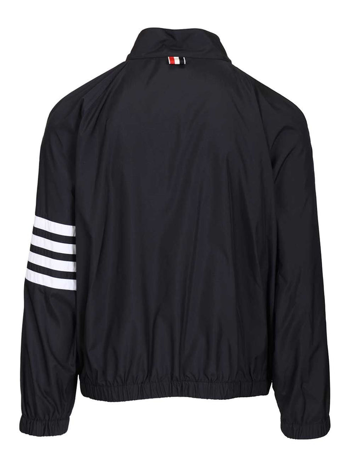 Thom Browne Zip Front Raglan Track Jacket W/ 4 Bar In Shiny Ripstop Jackets - Blue | 7db01d26be173fb5796665e9baa51a7785c6fd9e
