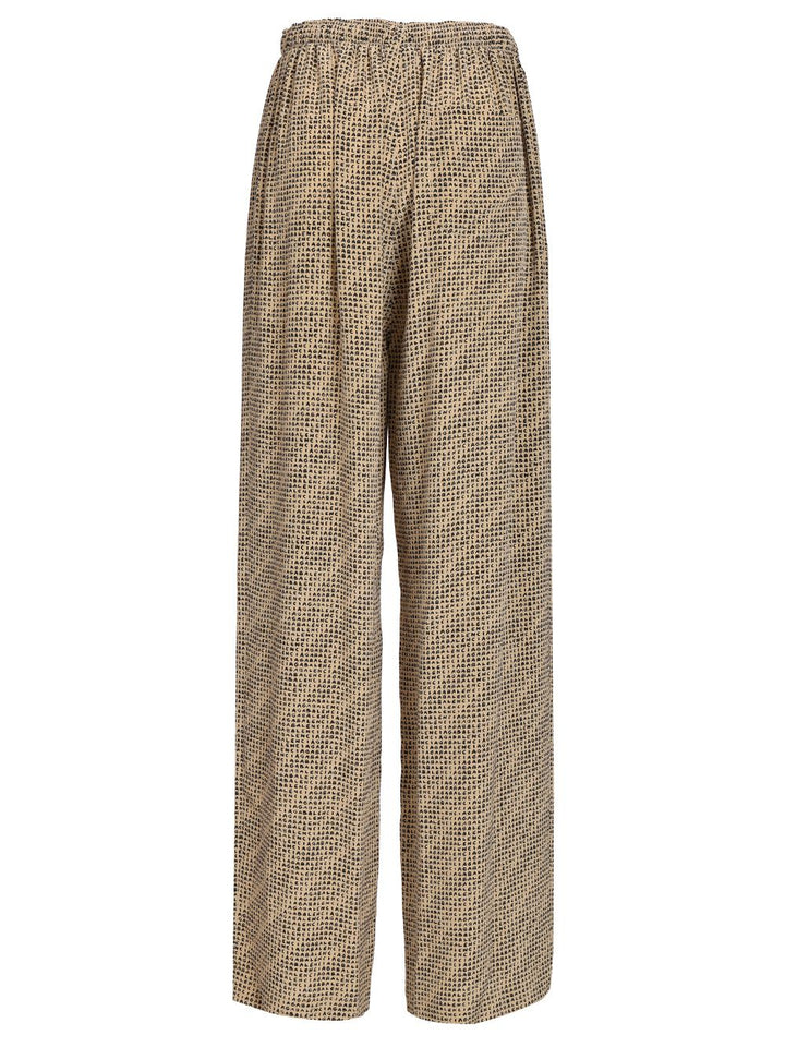 Balenciaga Monogram Trousers - Beige | 77b666039a4a8f1125fed4c444036b475758d979