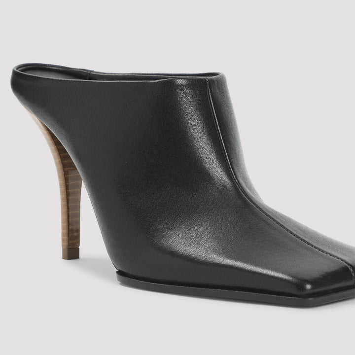 AlaÏA Mules - Black | 0ecbcc84d7a1eacfe0bc5d63f9abdbd5ff0b9b72