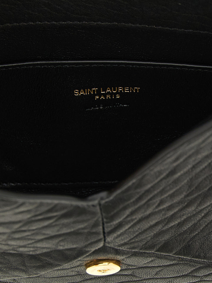 Saint Laurent Cassandre Clutch - Black | 8f541aeb5ee8e2eb9a55f62e95c769b339c036cb