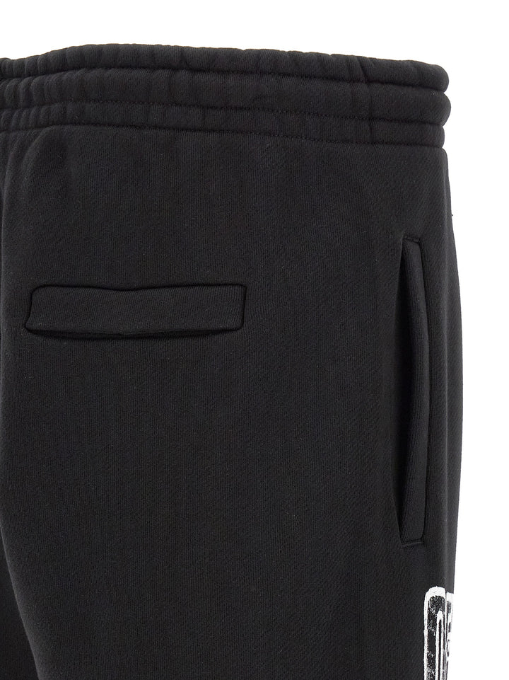 Off-White Motion Arrow Cuffed Pants - Black | 03c273ff37d70a0c50379c8fc14e27a093cb234c