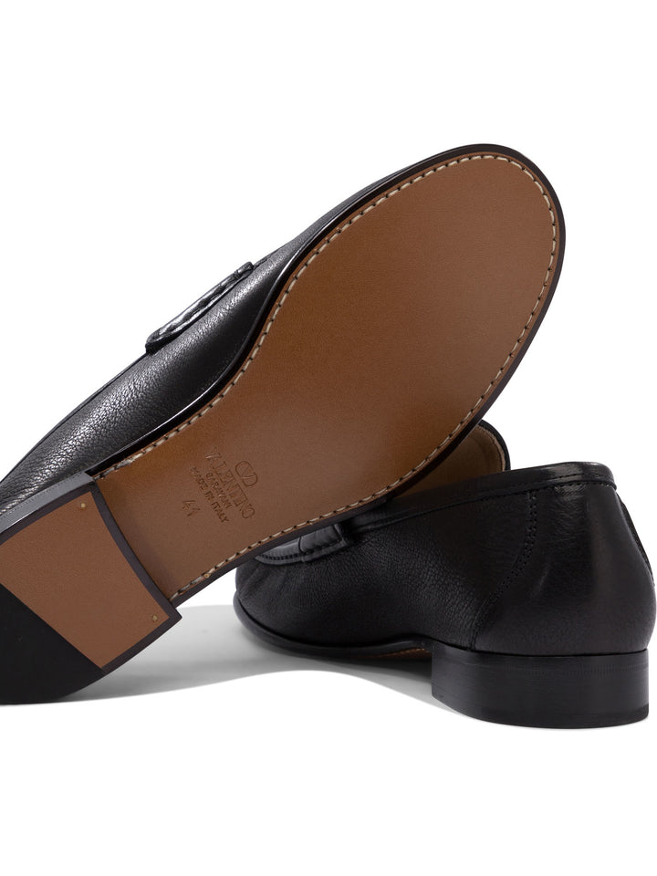 Valentino Garavani Vlogo Signature Loafers & Slippers - Black | 406614a0e2dc1fff568b446a83b53f46baea7426