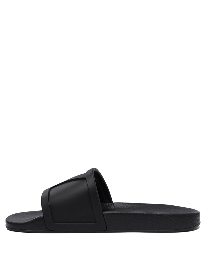 Valentino Garavani Slides With Vlogo Sandals - Black | e49917e41ba1e7a9b2f9f978dec90fb0a1cc719a