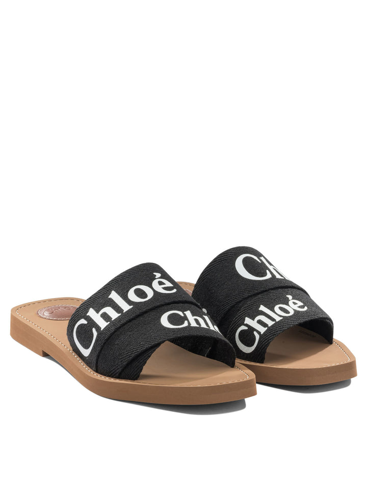 Chloé Woody Sandals - Black | 2303bc36f921f0eefbd7a736f7ca43d002bf03cd