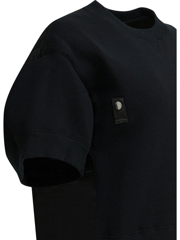 Sacai  T-shirts - Black | 8e9fd796b481e22299eaf6a5656766cd807f98fc