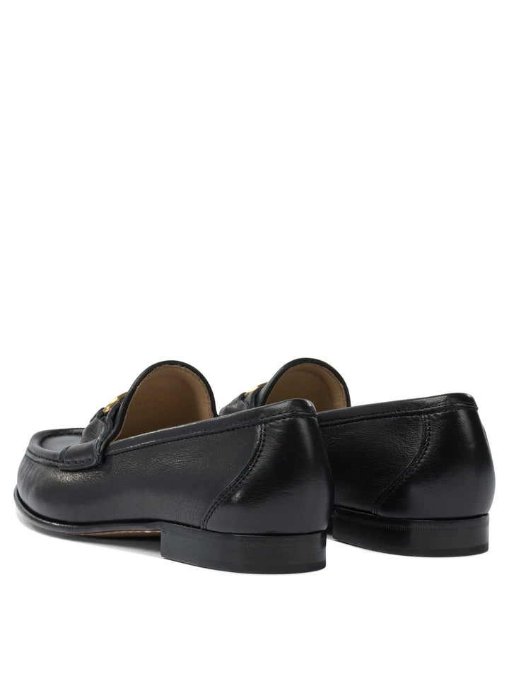Valentino Garavani Vlogo Signature Loafers & Slippers - Black | 1cc75d3eac16edeb609bf02ca4b11a0cd630cf92