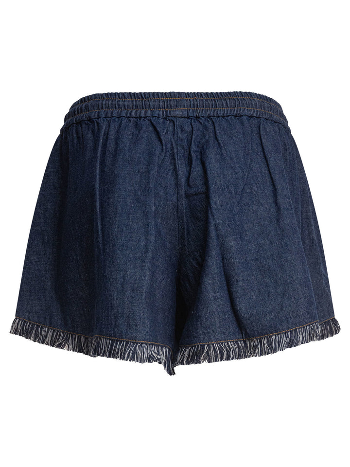 Zimmermann Rhiannon Fringe Denim Short Shorts - Blue | ca087630ea151c9413f40a983fb71b36e681b15e