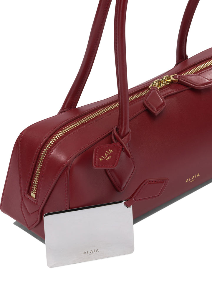AlaïA Le Teckel Shoulder Bags - Red | 0294eaa240ec3fa5fa7d306760516c72f0a5dfca