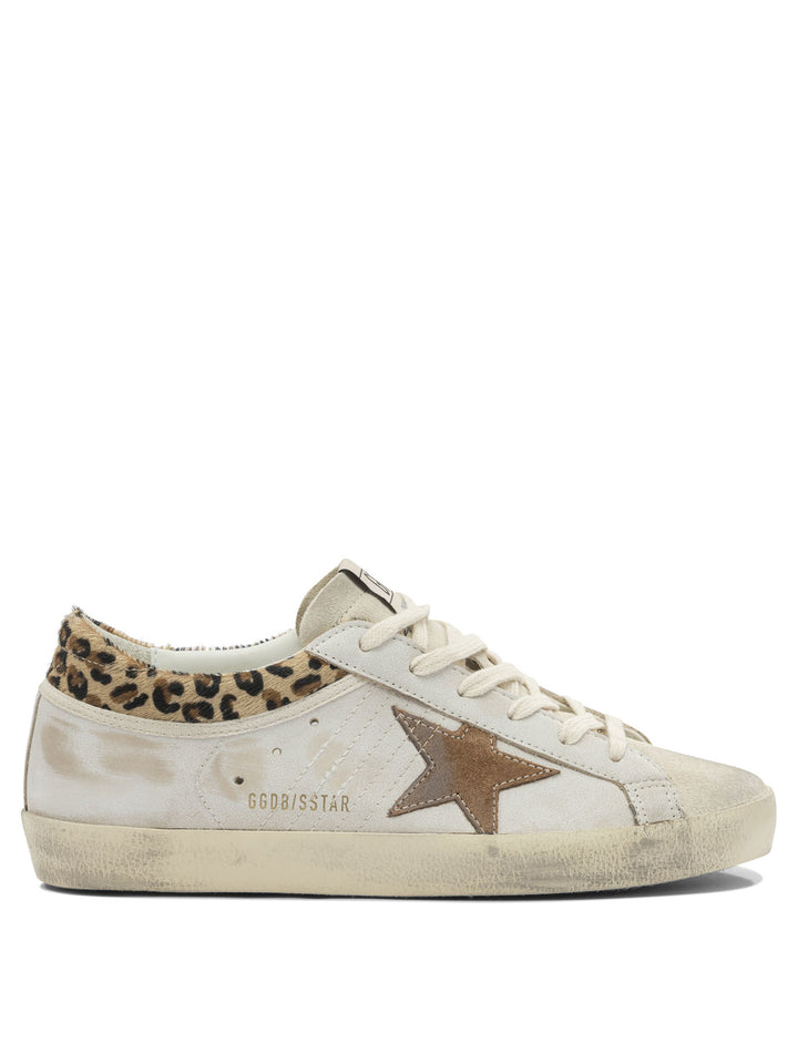 Golden Goose Super-Star Sneakers & Slip-On - White | e94ac590150a0447c595225665a827784948c88e
