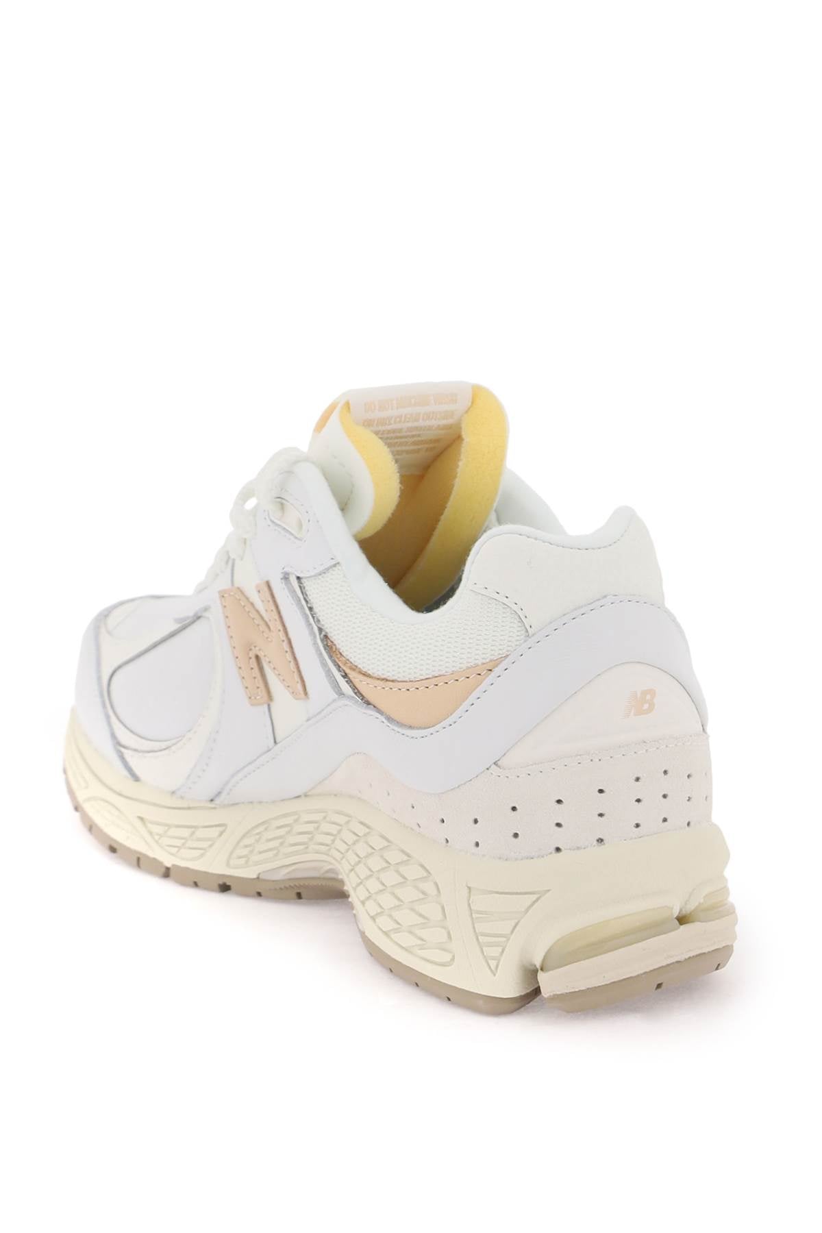 Shop New Balance 2002 R Sneakers In White